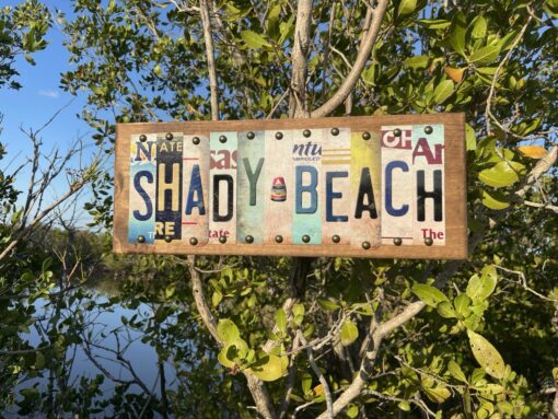 shady beach license plate sign